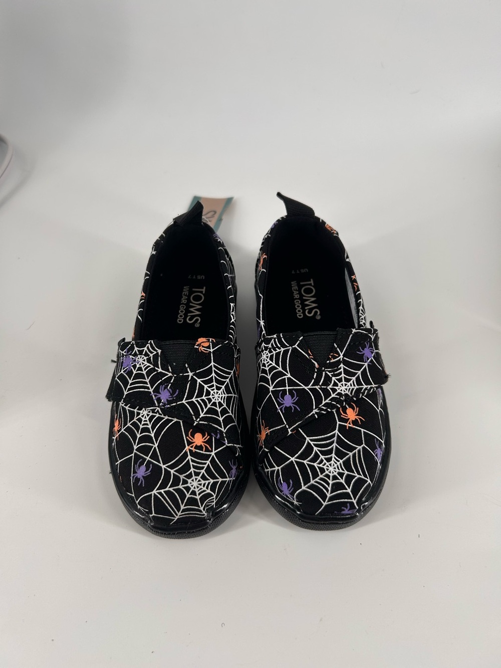 TOMS Kids Black Moccasins with Orange & Purple Spider Accents